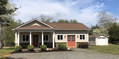 View of front facade featuring a porch, a shingled