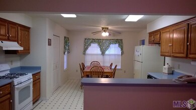 Spacious kitchen has a gas stove, pantry and an ea