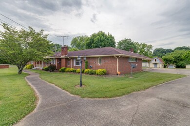 Side view as you go to the carport or garage.