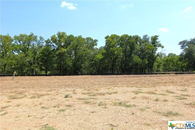 Building site pictured, beyond the tree line is th