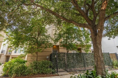 This contemporary three-story townhome features a