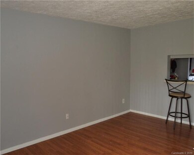 Spacious living room with fresh paint and laminate