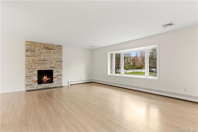 Living Room with hardwood floors, bay window and f