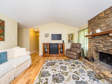 spacious living room with wood fireplace