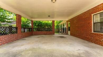 covered 2 car carport w/ gate to back yard