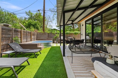 View of yard featuring a patio and a hot tub