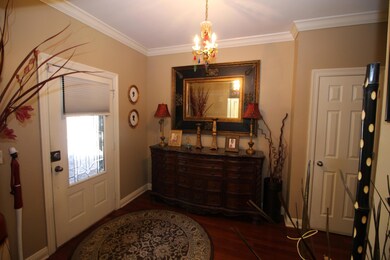 Foyer with hardwood floor