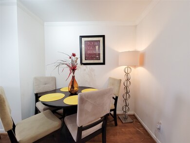 Cozy dining area with a round table set for four,