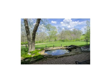 GORGEOUS LARGE FENCED BACKYARD with POND.