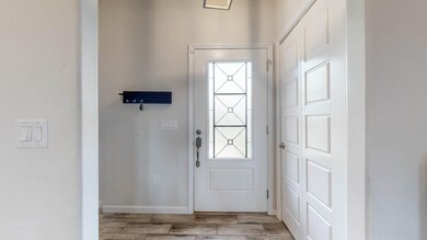 The front Foyer has an alcove perfect for a drop-zone for all of your things or some decor as well as a coat closet!