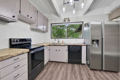 Second view of the kitchen highlights the butcher
