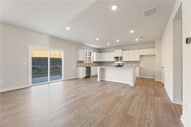Kitchen featuring stainless steel appliances, open