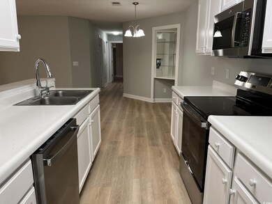 Kitchen with a sink, stainless steel appliances, l
