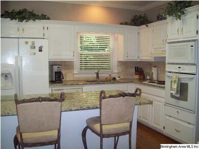 Sparkling Updated Eat-in-Kitchen features granite 