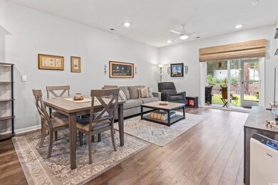 Dining space with ceiling fan, dark wood-type flooring, and recessed lighting