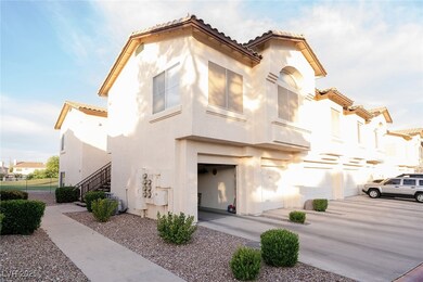 Mediterranean / spanish-style condo featuring a ti