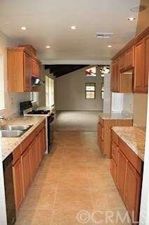 Galley kitchen with loads of upgrades and style.