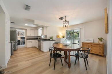 Kitchen has granite counters and an eat-in dining