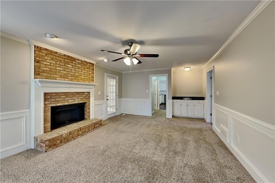 Unfurnished living room with a decorative wall, li