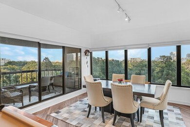 Dining space with track lighting and light hardwoo