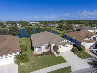 AERIAL PICTURE OF HOME OVER LOOKING NICE LAKE!