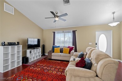 Living room featuring wood finished floors, ceilin
