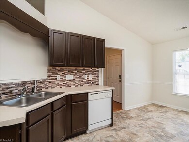 Kitchen with vaulted ceilings.
