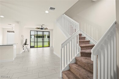 Stairway featuring baseboards and recessed lightin