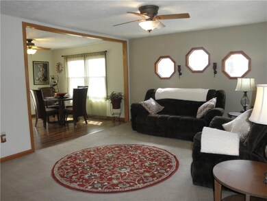 A different angle of the living room looking into the kitchen/dining area.