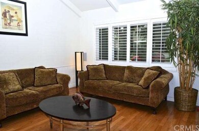 FORMAL LIVING ROOM WITH VAULTED CEILINGS AND PLANT