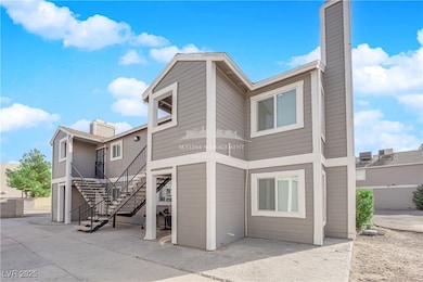 Back of house featuring stairway and a chimney