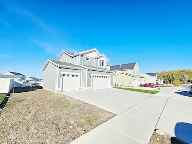 View of home's exterior with concrete driveway, an attached garage, and a residential view