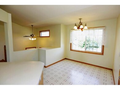 Eat-in kitchen area has big window and lots of gre