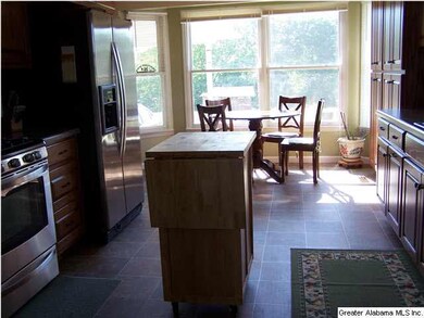 Eat in kitchen with custom wood cabinets!