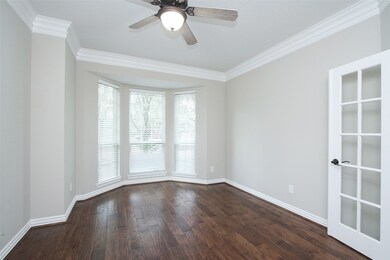 A quiet study/home office with front yard views and French doors is located off of the foyer.