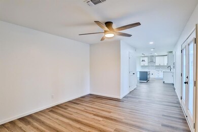 Spare room with hardwood / wood-style floors, sink