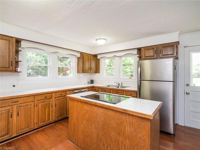 Kitchen with all stainless steel appliances! Tile counter tops and back splash!