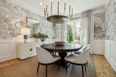 Dining area featuring wainscoting and a decorative