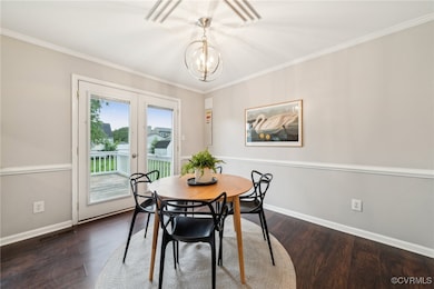 Dining area with baseboards, wood finished floors,