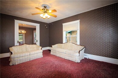 Formal living room with pocket doors leading to di