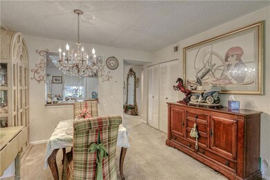 Dining room and pass through window into kitchen a