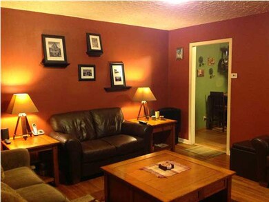 WARM INVITING LIVING ROOM WITH HARDWOOD FLOORS