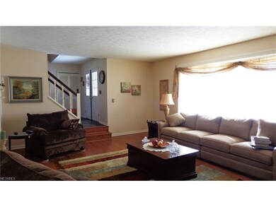 Living room features beautiful hardwood floors and