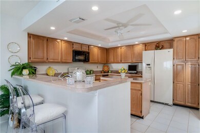 Lovely wood cabinets, large breakfast bar and newe