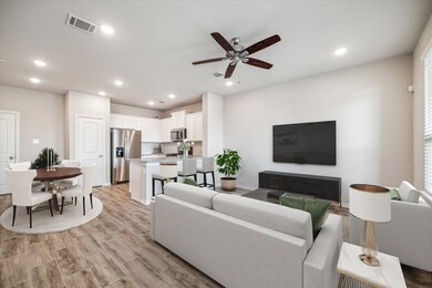 OPEN LIVING AREA TO KITCHEN & DINING
