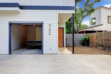 Garage featuring fence
