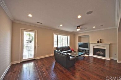 Family room features stunning hardwood floors, rec