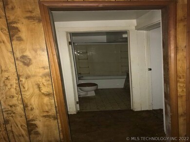Living room passed to bathroom and a bedroom on ea