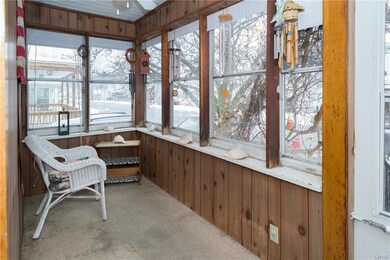 This is one of two darling enclosed porches this h