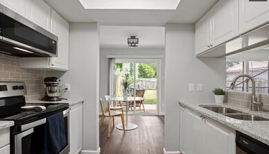 Kitchen with stainless steel appliances, a sink, 